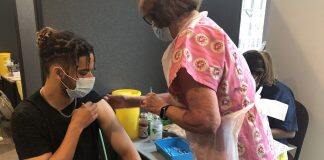 Hundreds of young people receive first Covid-19 jabs during two-day walk-in vaccination drive for over-18s at Kingston University
