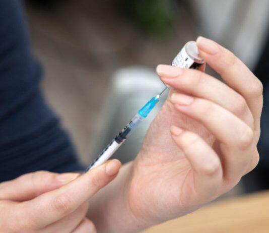 Interrupting immune-suppressing treatment can boost COVID vaccine response